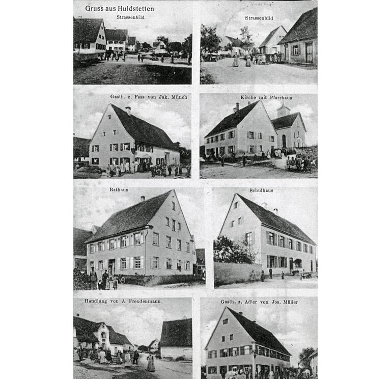 Historische Ansichtskarte von Pfronstetten-Huldstetten in Schwarz-weiß. Abgebildet und beschriftet sind "Strassenbild" (zweimal), "Gasth. z. Fass von Jak. Münch", "Kirche mit Pfarrhaus", "Rathaus", "Schulhaus", "Handlung von A. Freudenmann" und "Gasth. z. Adler von Jos. Müller". Oben rechts die Aufschrift "Gruss aus Huldstetten".